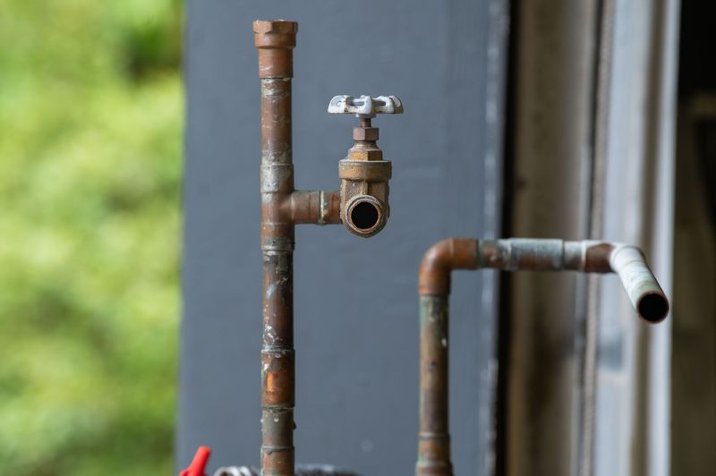 Plumber cleaning a clogged residential drain in Denver