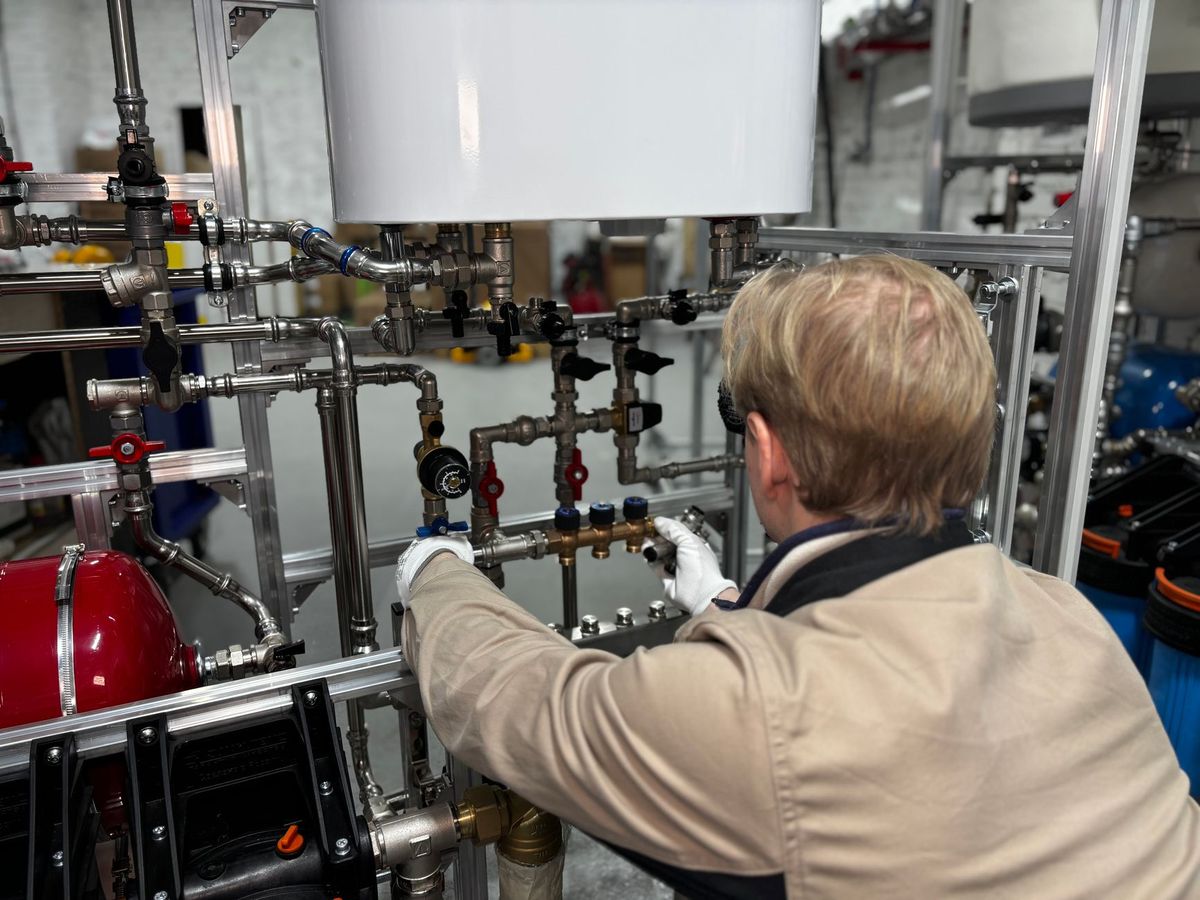 Peakstone Plumbing Co. plumber preparing tools for a Denver home service visit
